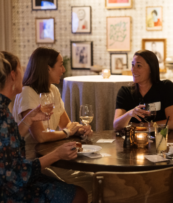 Members talking around a dinner table