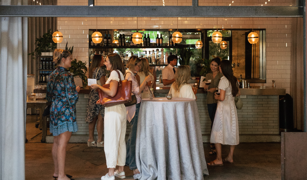 ALTA members talking at the bar during an evening event